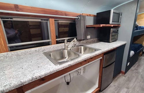 Eddyville House | Stationary renovated local school bus. Inquire about our hunter specials!