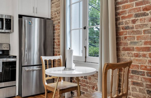 Faubourg Marigny Hotel | Stay in the center of the action with this charming 1-bedroom retreat located on the historic Esplanade Avenue. This unique space combines timeless New Orleans elegance with modern comfort, offering a serene escape just steps from Frenchmen Street.