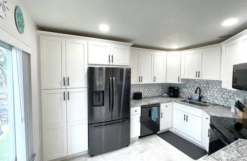 Cocoa Isles Country Club Condo | Stay Where Dolphins Play,Water Front