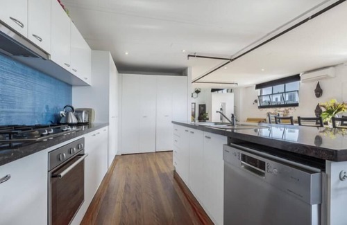 Collingwood North Apartment | StayCentral - Fitzroy Converted Warehouse Penthouse - Rose St, Fitzroy - 2 Bedrooms, 2 Beds, 1 Bathrooms, 1 secure undercover parking spot and 1 permit for street parking.