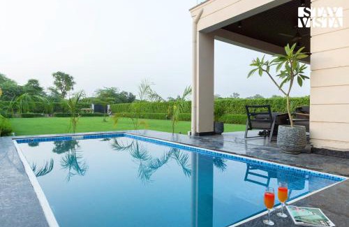 Gurugram Villa | StayVista at Olive Farms with Lawn, Pool, Bonfire & Hill Views