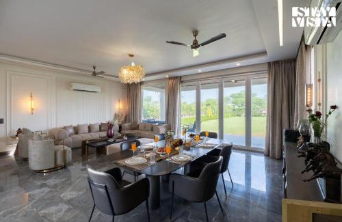 Gurugram Villa | StayVista at Olive Farms with Lawn, Pool, Bonfire & Hill Views