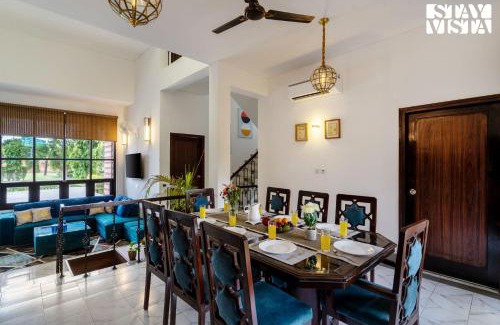 Dwarka Villa | StayVista at The Cityscape with Lawn & Pool