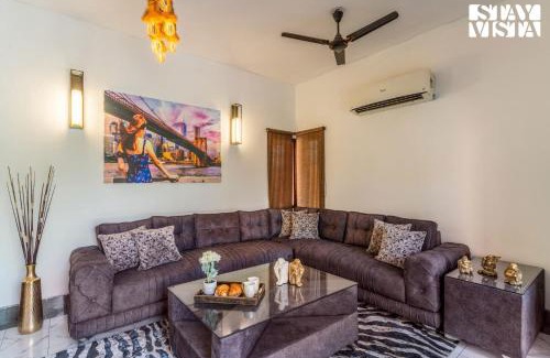 Dwarka Villa | StayVista at The Cityscape with Lawn & Pool
