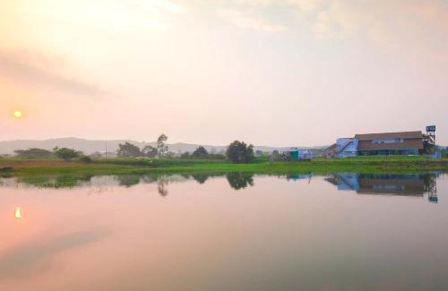Nashik Villa | StayVista's Eva Villa - Lakeside Luxury with Modern Decor, Pool & Expansive Lawn - Near Sula