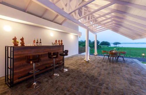 Nashik Villa | StayVista's Eva Villa - Lakeside Luxury with Modern Decor, Pool & Expansive Lawn - Near Sula