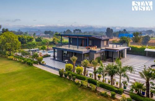 Faridabad Villa | StayVista's Hampton Acres - Outdoor Pool, Vast Lawn & Terrace