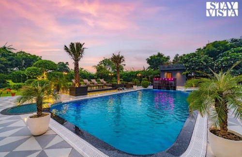 Faridabad Villa | StayVista's Hampton Acres - Outdoor Pool, Vast Lawn & Terrace