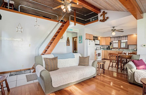 Paw Paw Lake House | Stealth Cottage | Lakeside historic stay with a dock, bars, and athletic courts