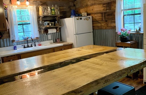 Cool Ridge Cabin | Step back in time with this unique cozy cabin by the creek.