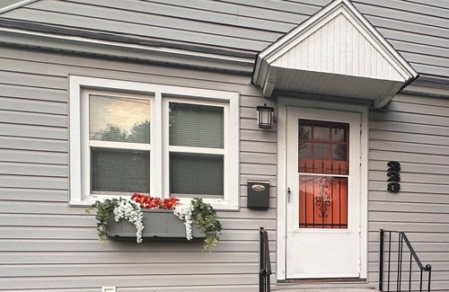 Sheridan House | "Steps from downtown and the park, this cozy mid-century hideaway offers comfort, charm, and a private outdoor escape."