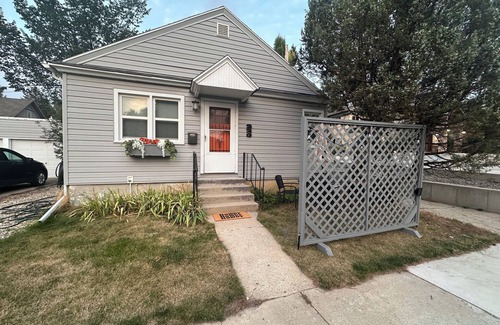 Sheridan House | "Steps from downtown and the park, this cozy mid-century hideaway offers comfort, charm, and a private outdoor escape."