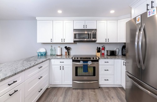 Laconia Condo | Steps to Beach: Lake-View Laconia Getaway!