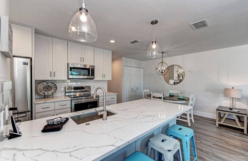 Holmes Beach House | Steps to the beach! PRIVATE HEATED POOL w covered lanai. Central location.