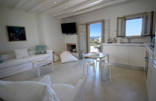 Chrissi Akti House | Stone sea view house with a beautiful garden close to an amazing sandy beach