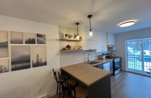 Stoneham Condo | Stonham Condo with Hot Tub! Perfect for hiking, golf or mountain biking.