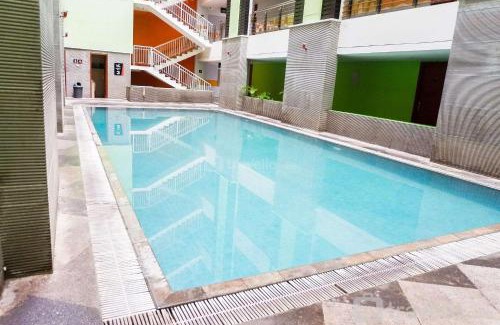 Siwalankerto Apartment | Strategic Studio Apartment at High Point Serviced By Travelio