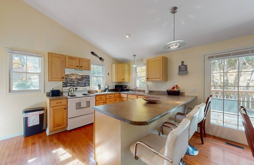 Frank House | Streamside cottage on +2 acres with large deck, firepit, fireplace, & W/D