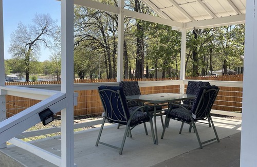 Porum Cabin | Studio cabin #2 with lake view, boat dock access, outdoor seating, and firepit.