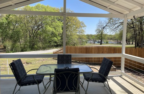 Porum Cabin | Studio cabin #3 with lake view and boat dock access, outdoor seating.