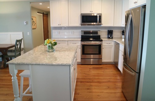Suttons Bay Cottage | Stunning 150' ft footage on bay, 2 beachfront homes, 5 bedrooms & game room.