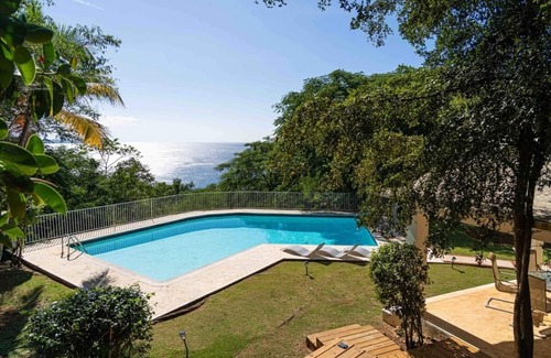Borinquen Villa | Stunning 1950's grand house nestled in lush greenery overlooking the bay