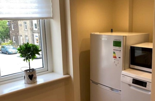 Barnoldswick Apartment | Stunning apartment + private garden. 5 mins walk to shops and bars.