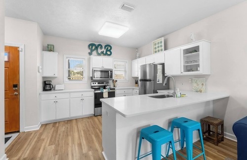 Bel Air House | Stunning Beachside Townhouse with Pool, 2 Car Garage, and Lagoon Access