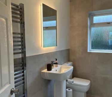 Woodmansey House | Stunning Beverley Bungalow w Fireplace, private parking, and garden