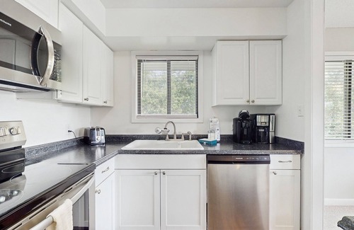 Caswell Beach Condo | Stunning coastal condo with shared pool and views of golf course