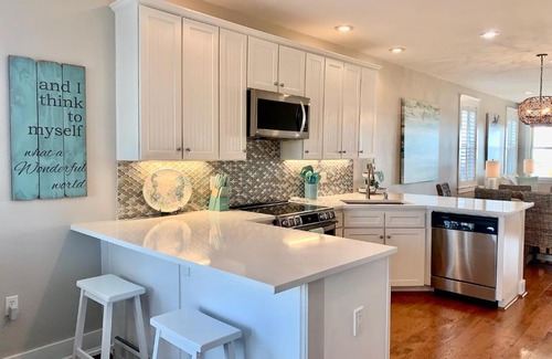 Red Fish Cove Villa | STUNNING Designer BEACHFRONT With TRIPLE WATER VIEWS OF OCEAN, LAKE, BAY!