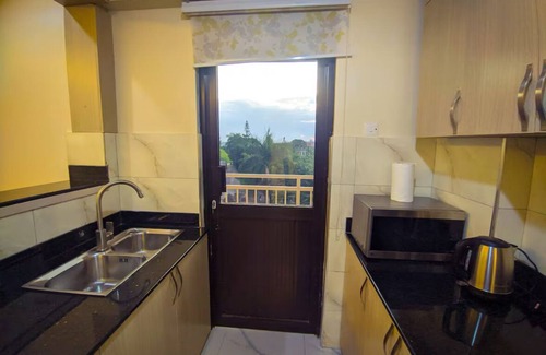 Central Kampala Bed & Breakfast | stunning golden views just a short 10-minute walk to Acacia Mall buzz