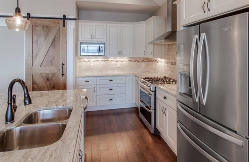 Suttons Bay House | Stunning Lakefront Home With Dock and Boat Lift