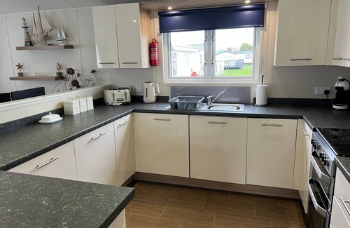 Great Yarmouth Cabin | Stunning lodge boasting large decking area at California Cliffs ref 50008L