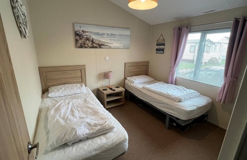 Great Yarmouth Cabin | Stunning lodge boasting large decking area at California Cliffs ref 50008L