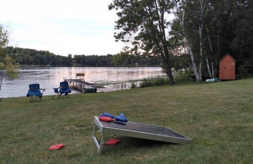 Grantsburg Cabin | Stunning log home with a rental pontoon on a quiet sunlit bay. Check it out!