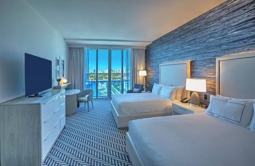 Central Beach Hotel | Stunning Marina Views, Private Balcony, inviting Pool, steps from Riverwalk