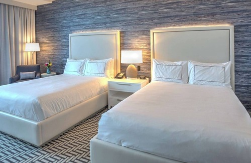 Central Beach Hotel | Stunning Marina Views, Private Balcony, inviting Pool, steps from Riverwalk