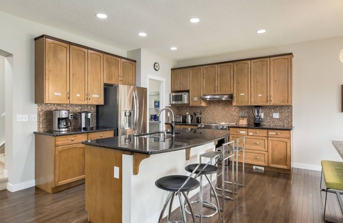 Southwest Calgary House | Stunning Oasis in Upscale Aspen Woods, Close to COP & Downtown