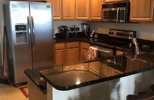 Steinhatchee Condo | Stunning Top Floor Views of The Steinhatchee River with Private Boat Slip/Pool!
