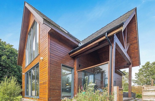 Menai Bridge Ski Chalet | Stunning two storey contemporary lodge on the edge of the lake.