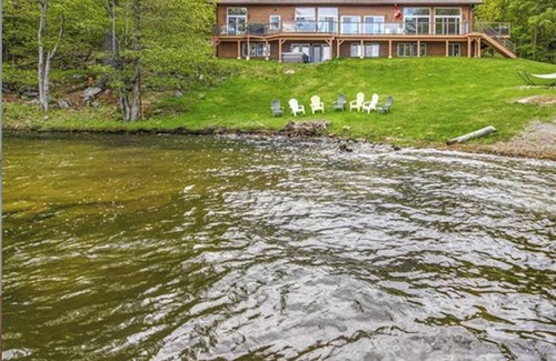 Rideau Lakes House | Stunning waterfront home nestled in a private bay on Opinicon Lake, pet friendly