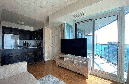 Toronto Entertainment District Apartment | Stylish 1 Bedroom Condo with Unobstructed CN Tower View