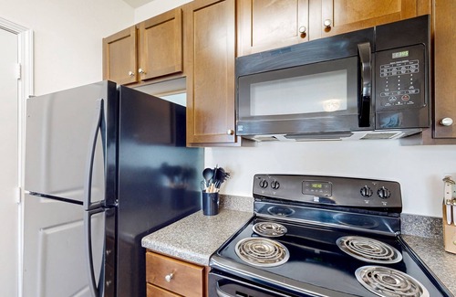 Goose Creek Condo | Stylish 2BR: Pet Friendly in Walkable Resort with a Pool