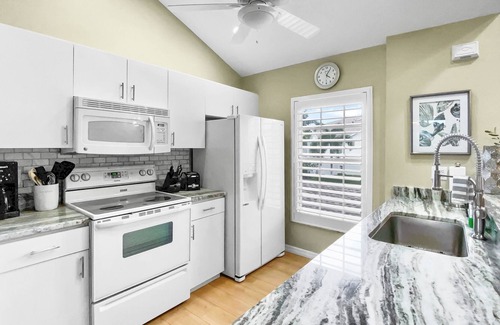 Vamo Condo | Stylish 3 bedroom, 2 bath Palmer Ranch Sarasota condo with a lake view.