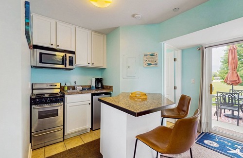 Douglas Condo | Stylish condo with well-equipped kitchen, pool, firepits, & gas fireplace