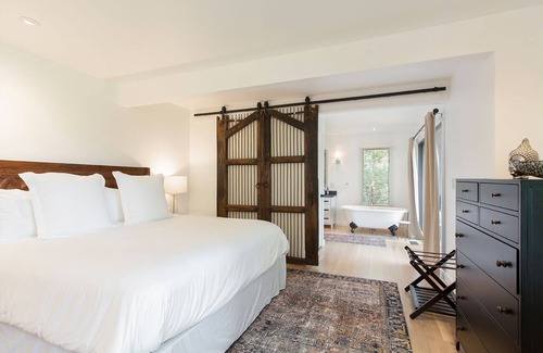 Hendersonville Cottage | Stylish cottage bordering one of the farm's sweeping pastures.