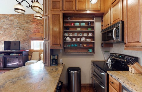Historic Downtown Durango Apartment | Stylish, downtown condo w/loft, kitchen, & fireplace plus shared patio & grill