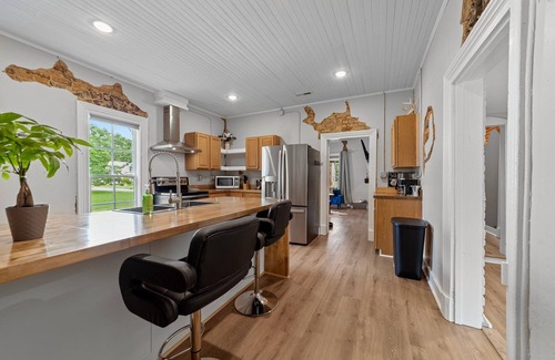 Graham House | Stylish downtown home: private hot tub, outdoor pizza oven & bumper pool table