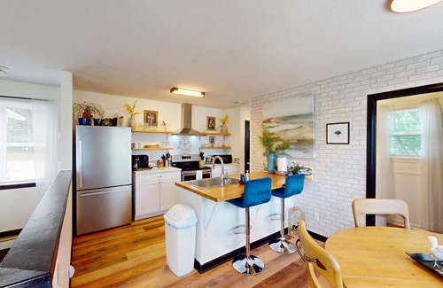 Piney House | Stylish duplex with lakefront views, modern design, and spacious interiors